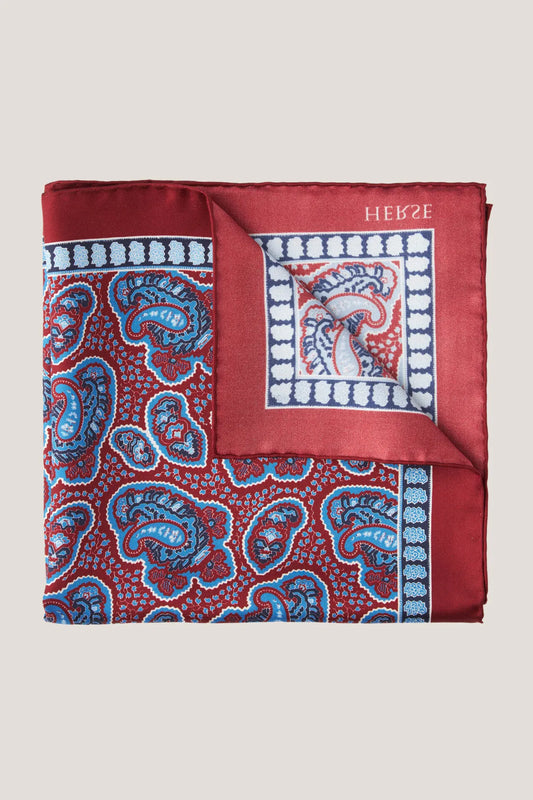 Burgundy pocket square with a varied paisley pattern
