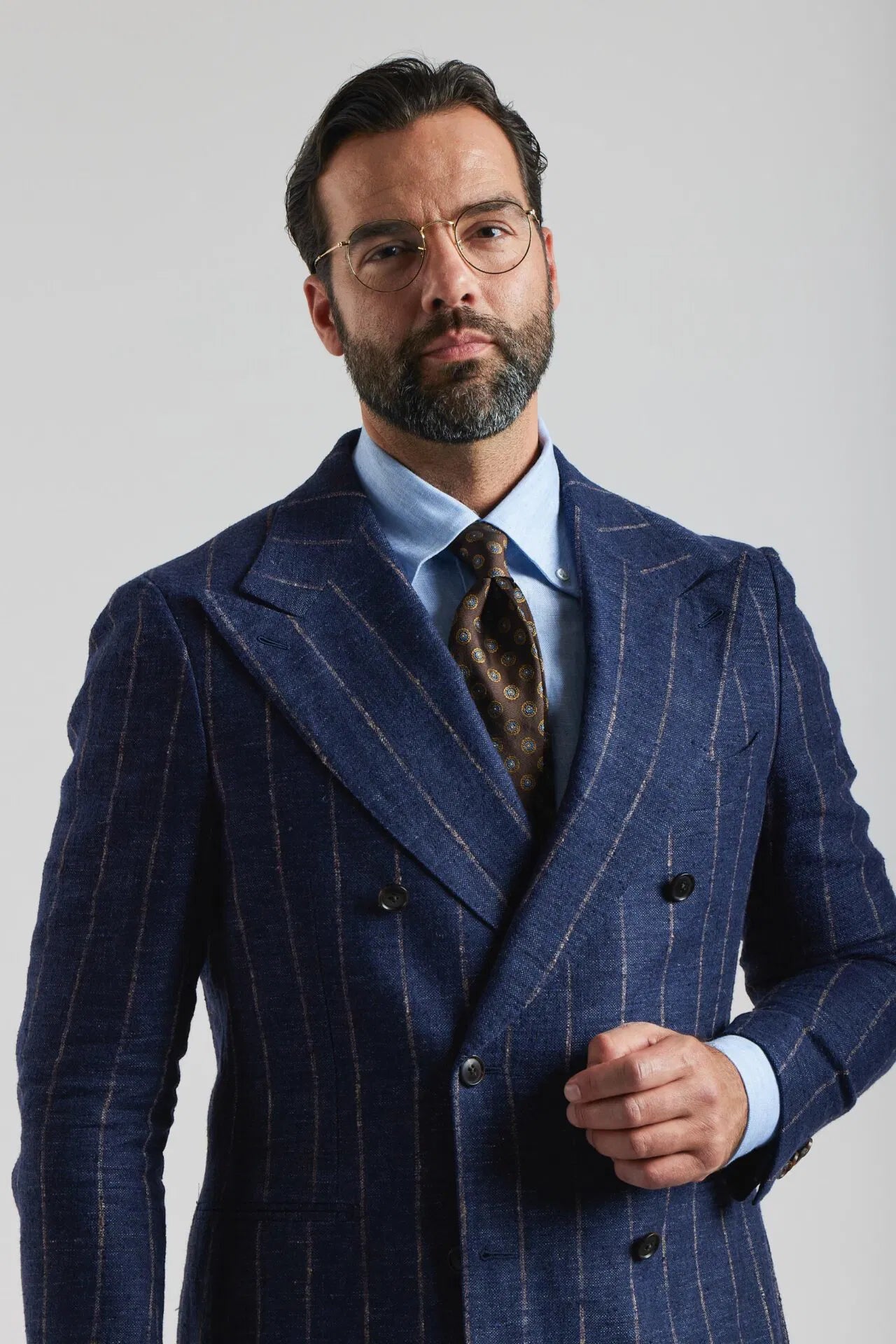 Navy blue double-breasted suit in Ferla fabric with a pinstripe pattern