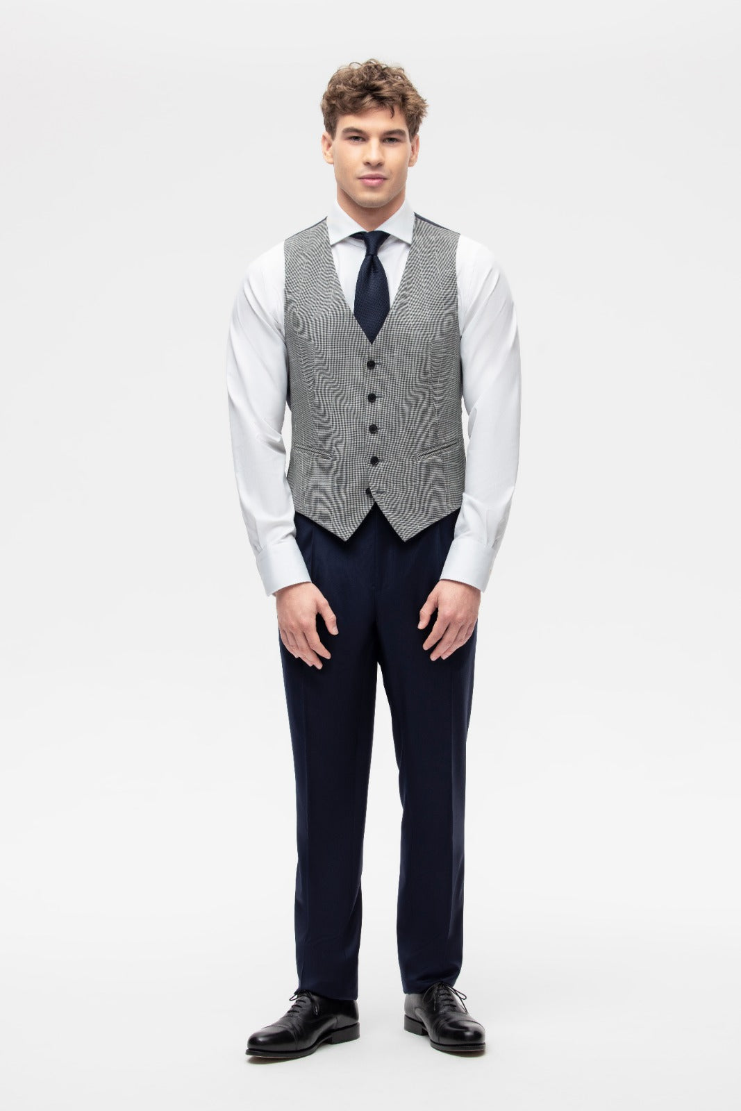 Gray houndstooth vest with beige overcheck