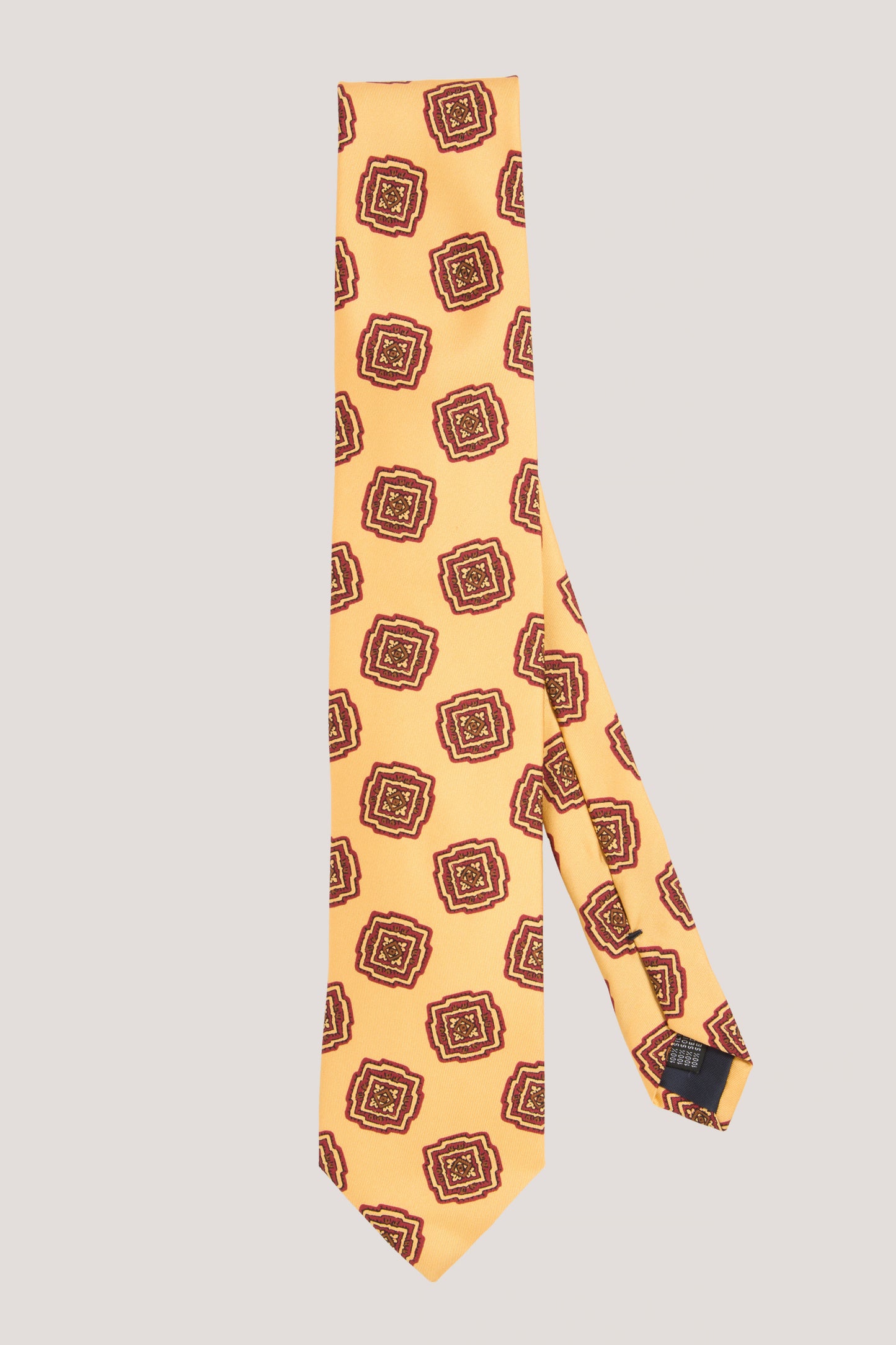 Yellow silk tie with ornaments