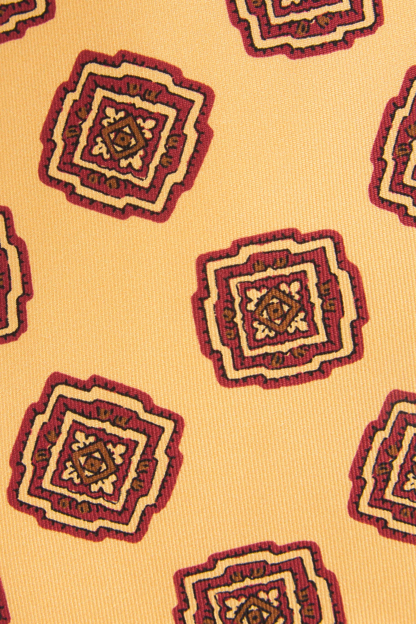 Yellow silk tie with ornaments